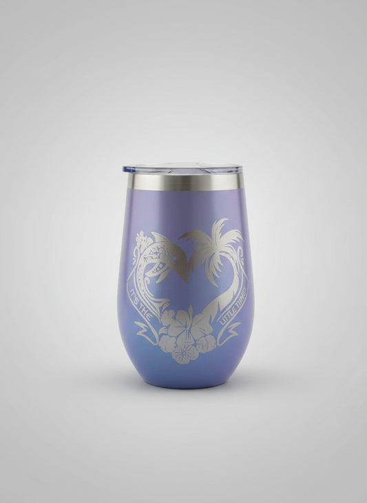 Blue tumbler with a design on a grey background.