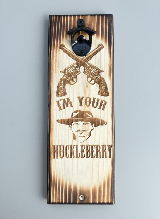 Wooden sign with crossed revolvers, a bottle opener, and text on a dark background