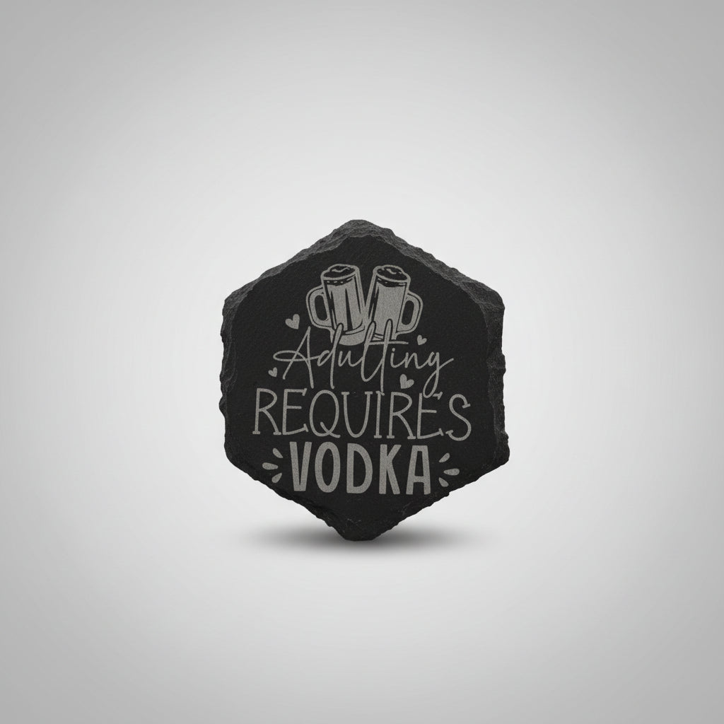Decorative stone with 'ADULTING REQUIRES VODKA' text on a textured wall background