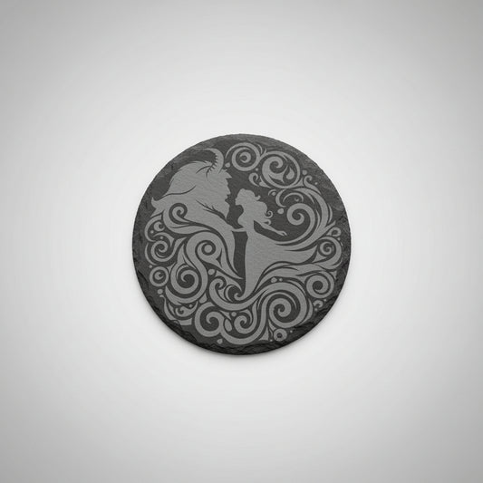 Decorative round object with a silhouette design on a pink surface